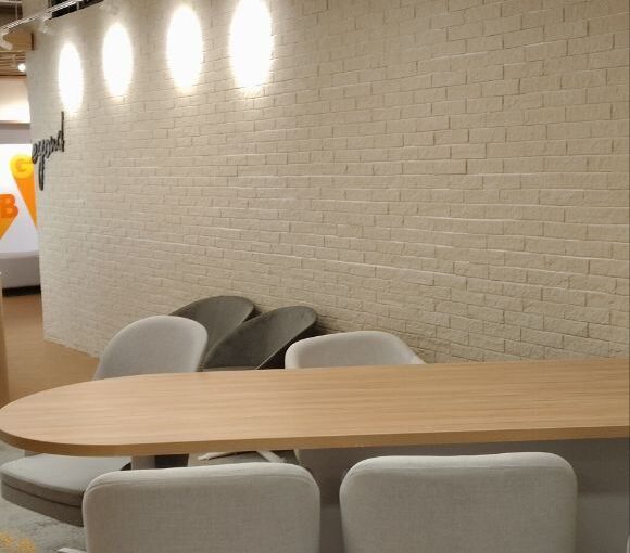 Frameless office glass partition installed in modern commercial space in Chennai